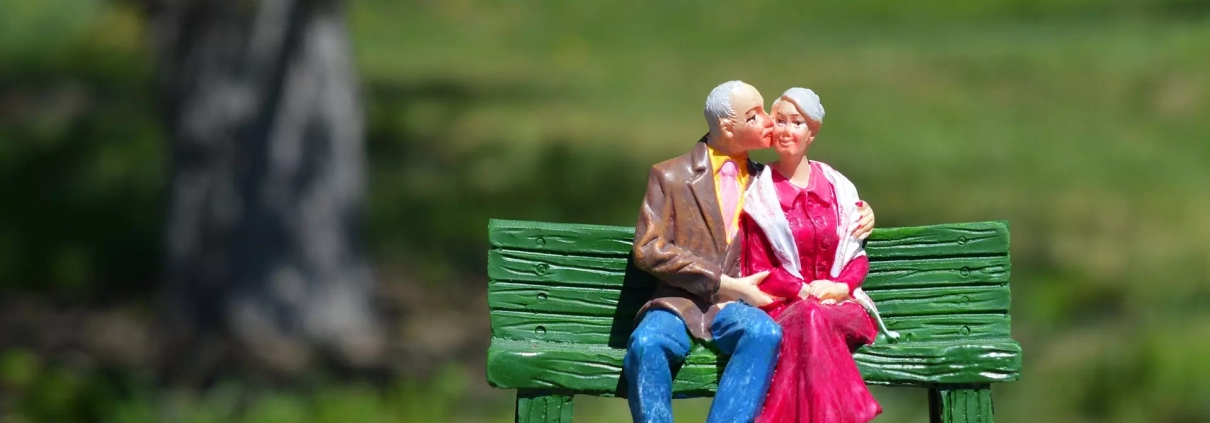 Miniature of an elderly couple.