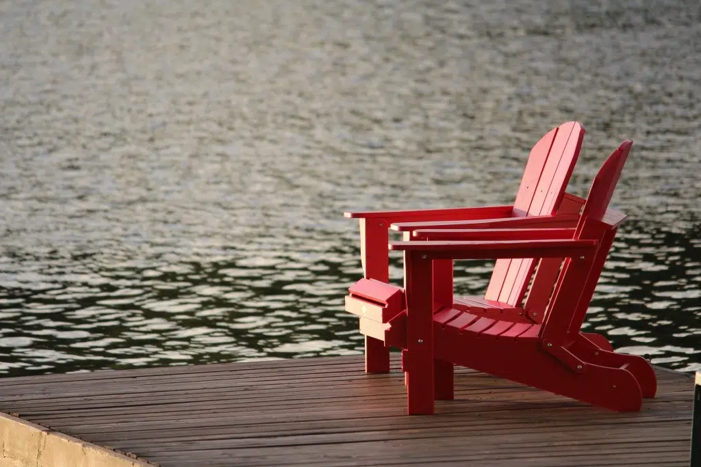 Two chairs in a lake.