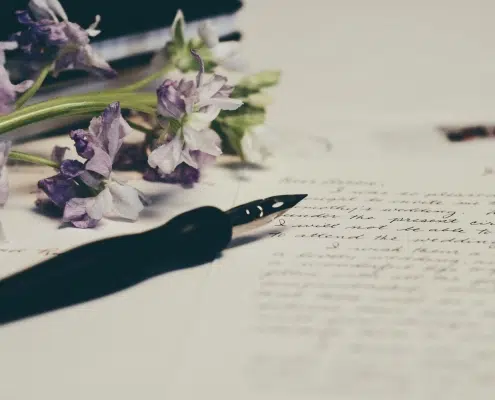 Written paper and a flower.