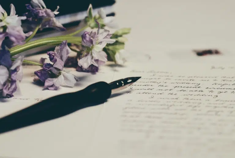 Written paper and a flower.