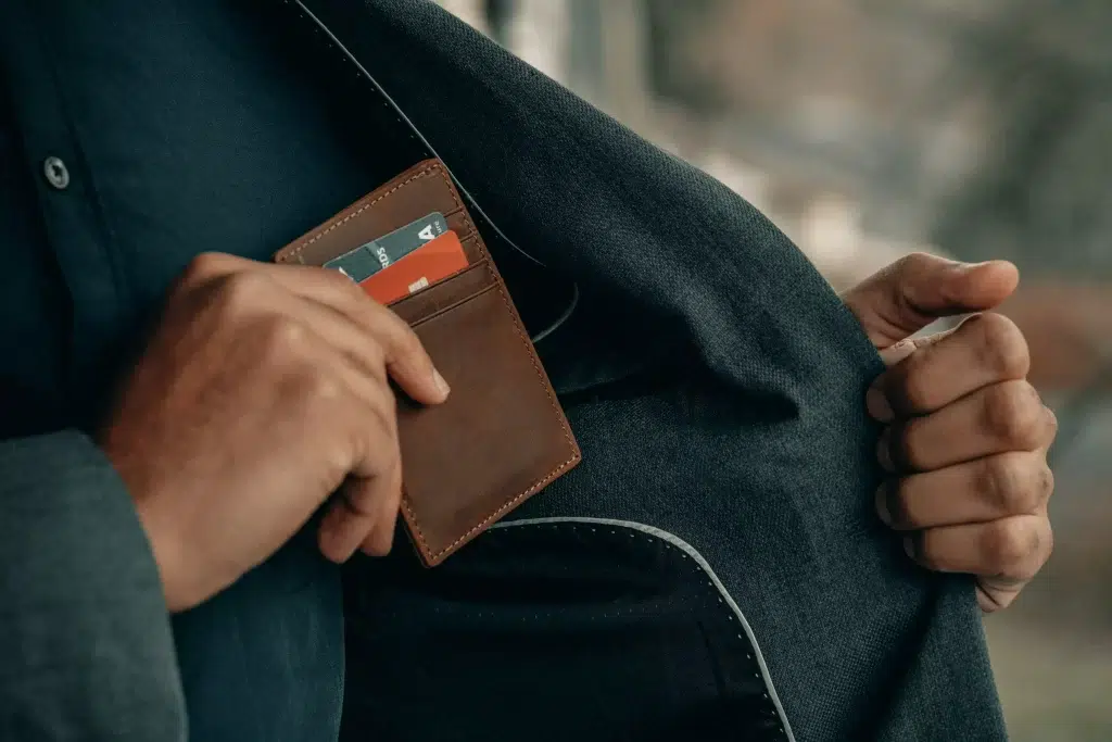 Man pocketing his wallet.