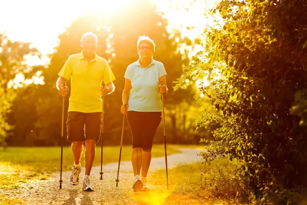 An elderly couple having a walk together.