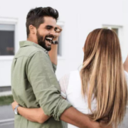 Happy couple buying a house.