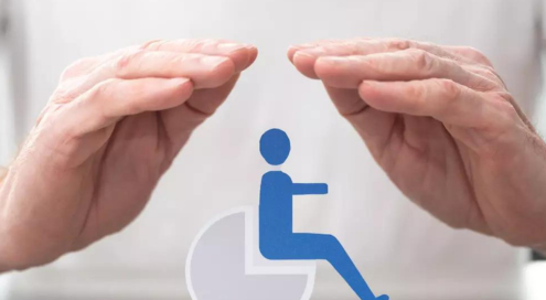 Two hands protecting a PWD signage.