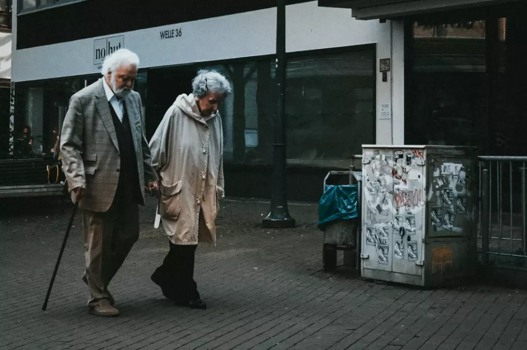 Senior couple walking together in the city.