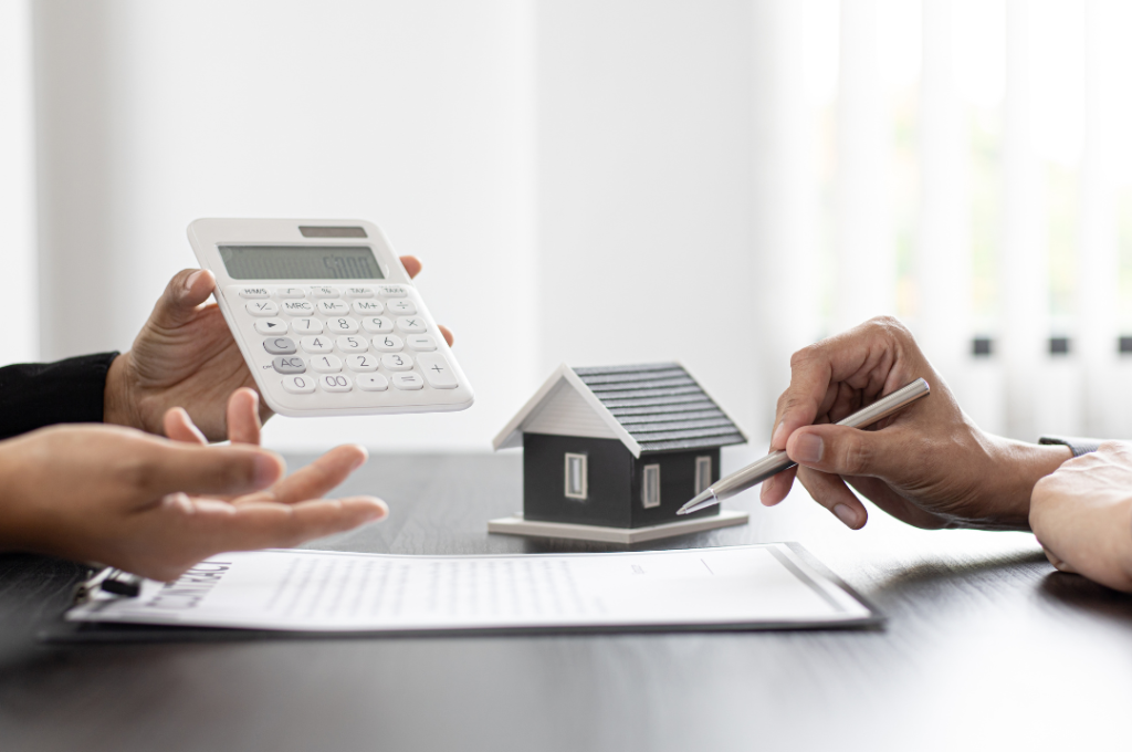 A person showing the calculation of the capital gains tax to the other person.