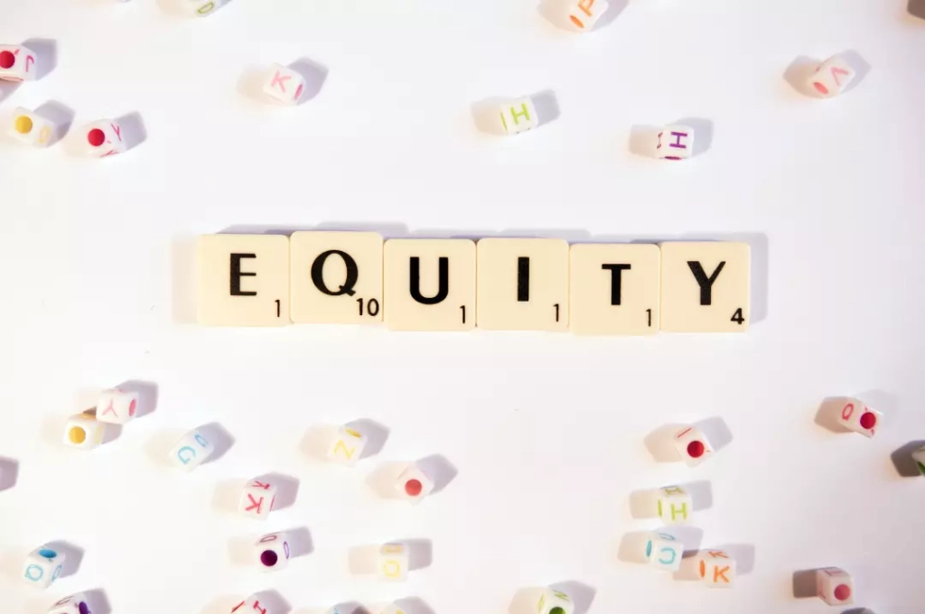 White cubes forming the word equity.