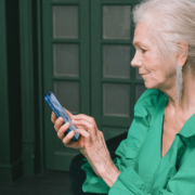 A self-funded retiree using her smartphone.