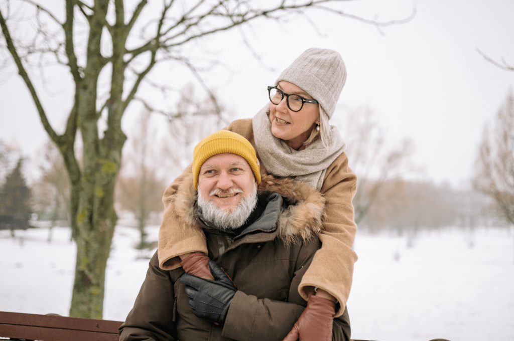 Elderly couple in winter clothing.