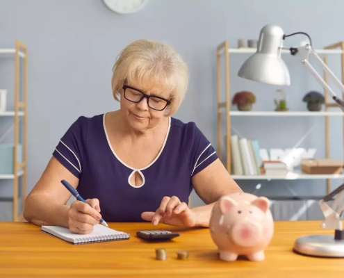 Senior woman thinking whether to put extra money into super or mortgage.