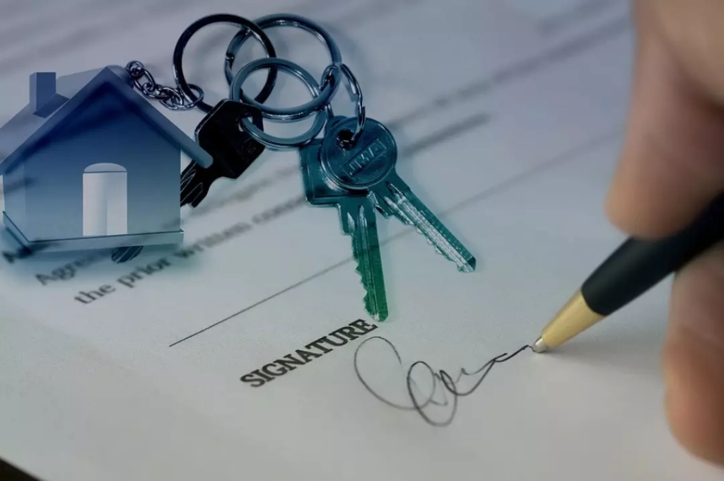 Signing an agreement about buying a house.