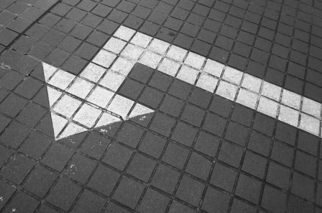 White arrow on pavement.