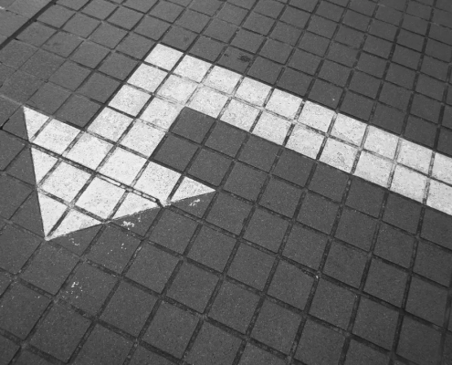White arrow on pavement.
